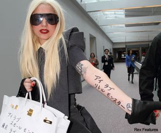 Lady Gaga sciribbles fan message on her Hermes Birkin - Japan, graffiti, arm, writes, tattoo - Celeb news - Marie Claire