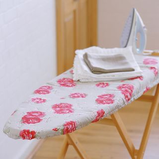 iron with ironing board and cloths