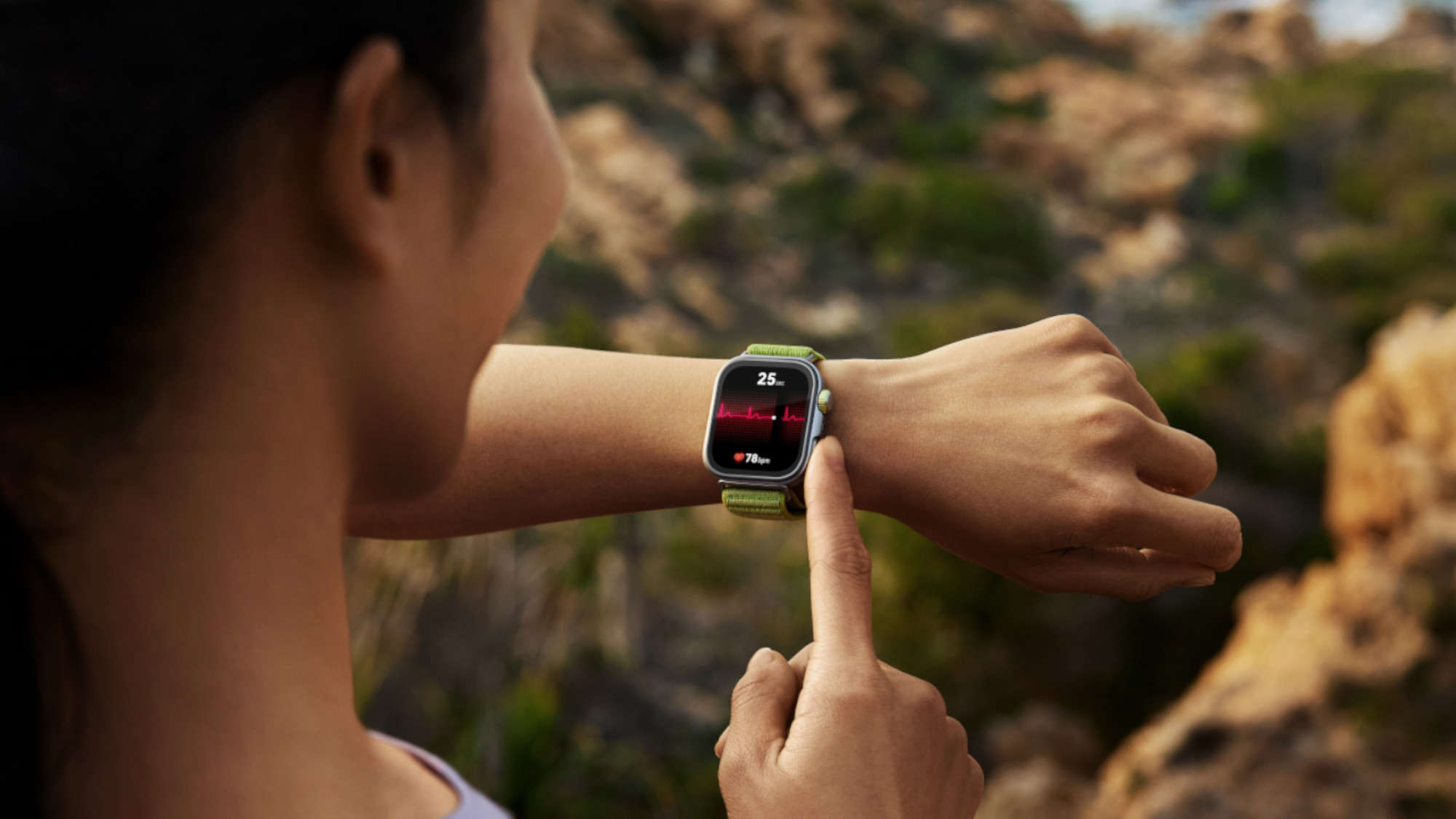 Image of a woman pressing a button on the side of the Huawei Watch Fit Pro 4 smartwatch