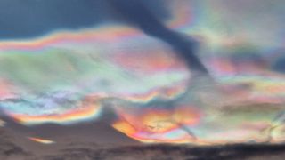 Iridescent, rainbow-colored clouds in the sky