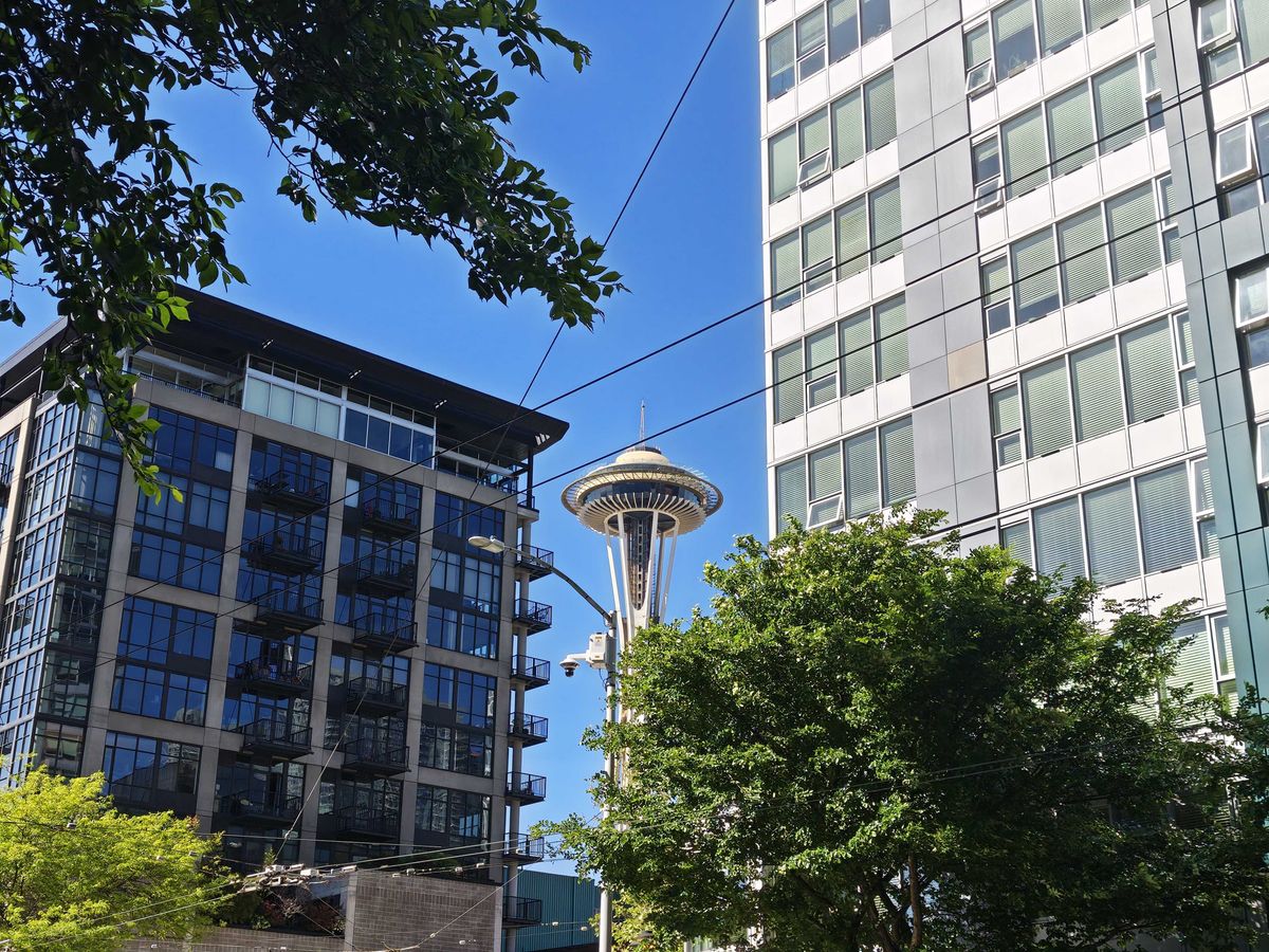 The Seattle Space Needle between two buildings