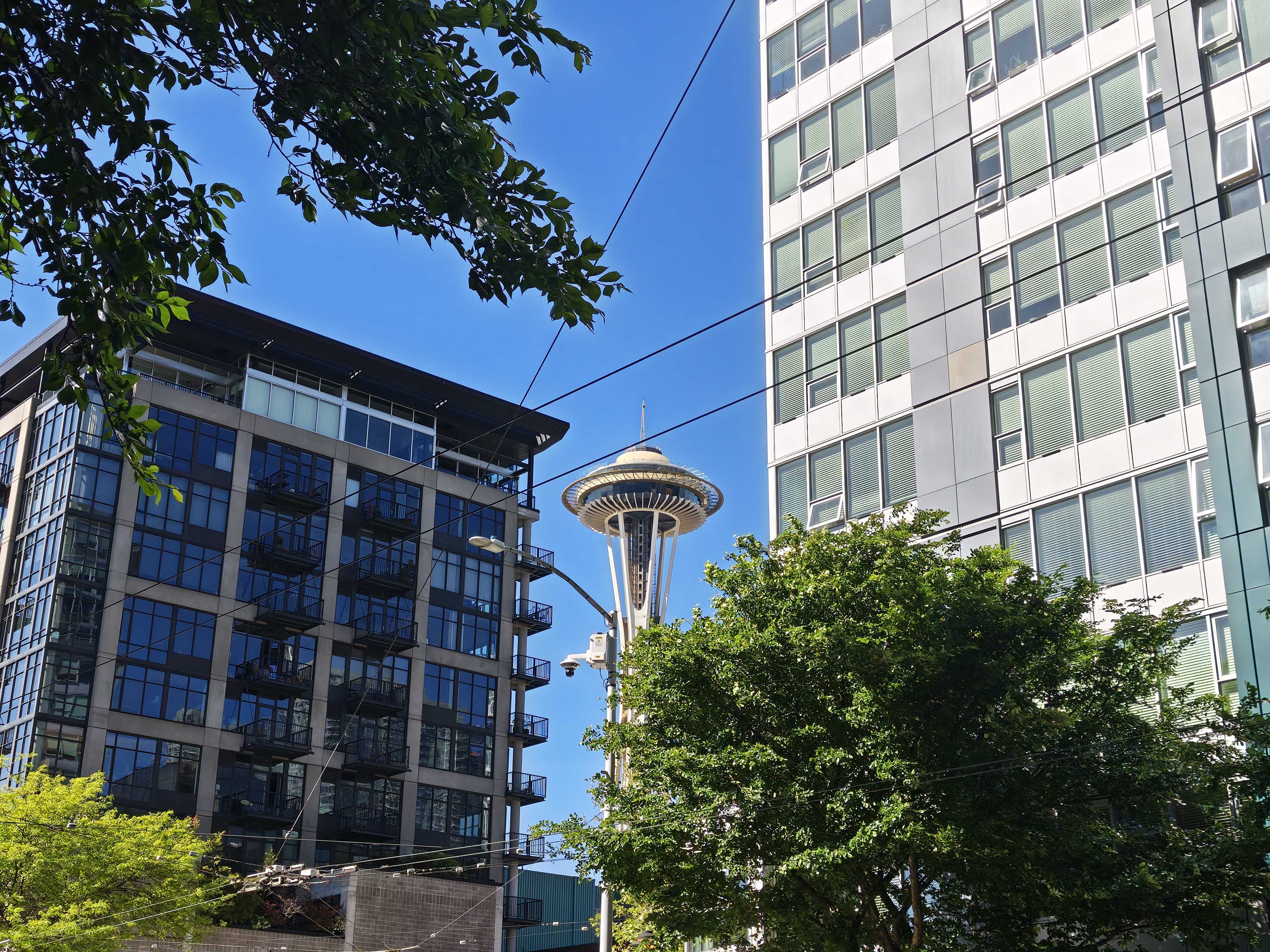The Seattle Space Needle between two buildings