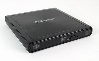 The Gateway E-100M's external CD/DVD drive.