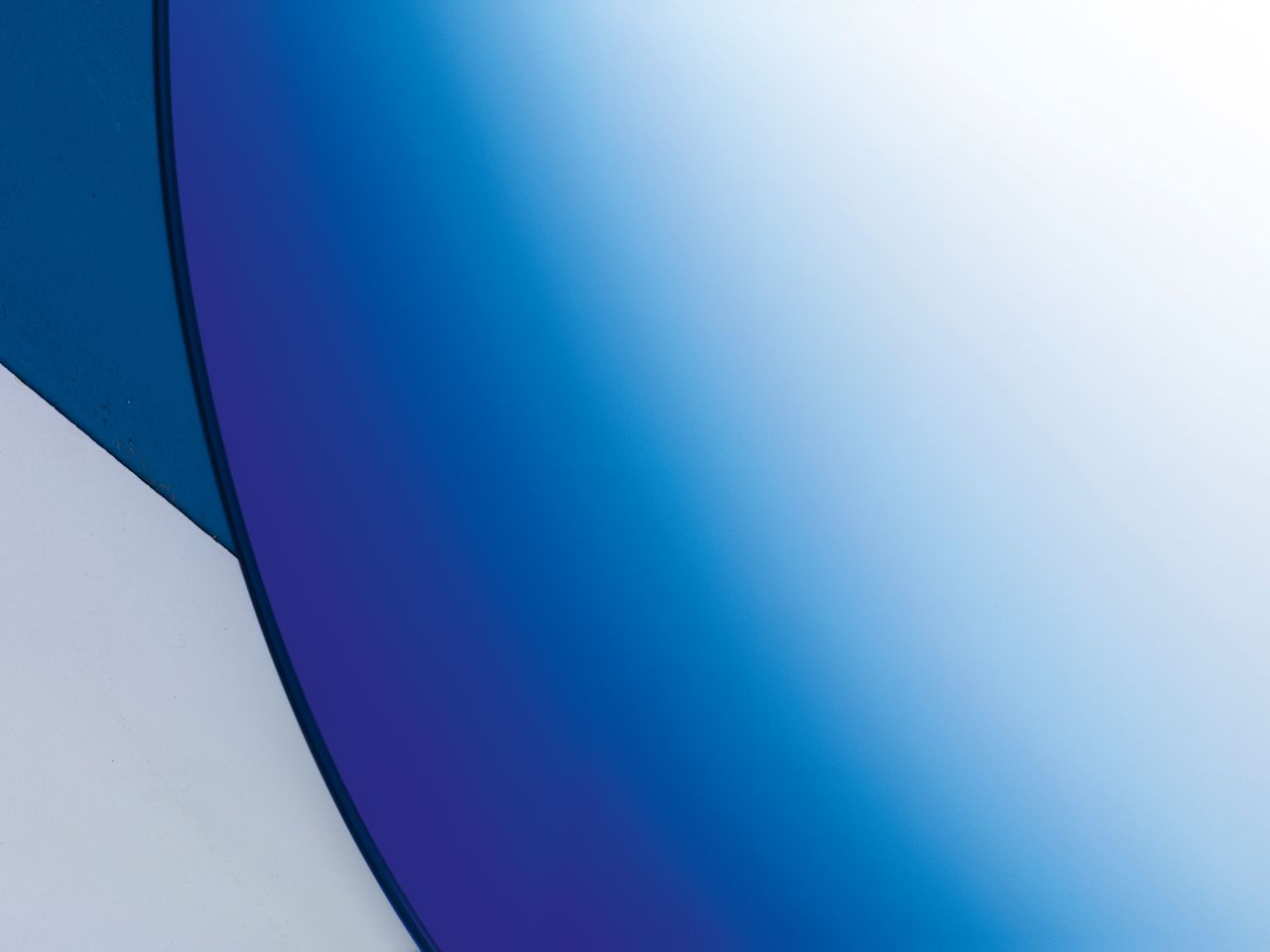 Form, shape and colour come together to alter the viewer's reflected face and surroundings