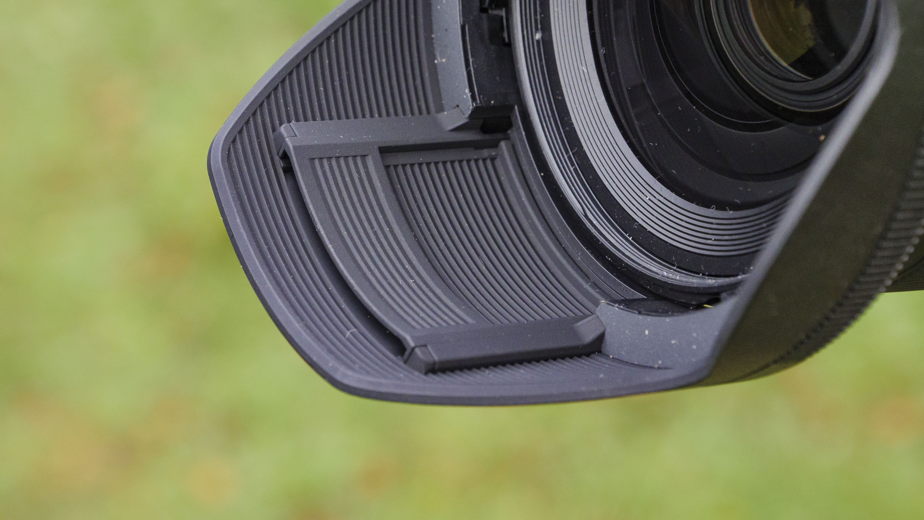 Closeup of the Nikon Z 24-70mm f/2.8 S II lens' lens hood with filter hatch closed