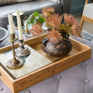 wooden coffee table tray with book, flowers and candlesticks