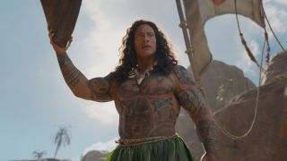 Dwayne Johnson as Maui riding on a boat in 2016's Moana