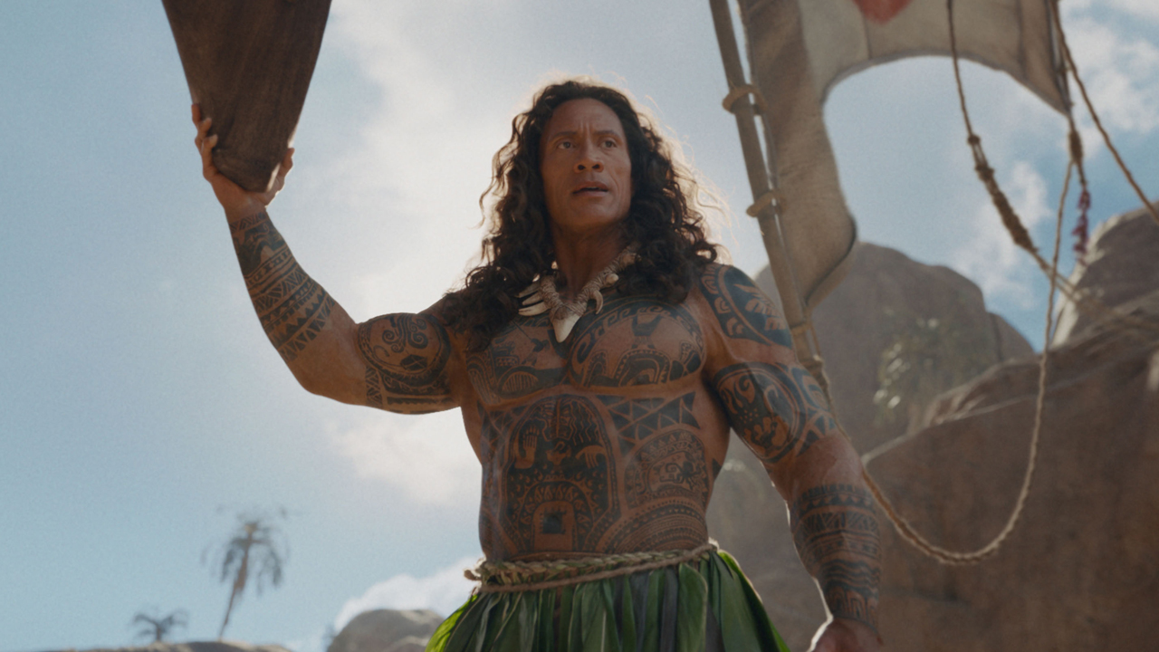 Dwayne Johnson as Maui riding on a boat in 2016's Moana