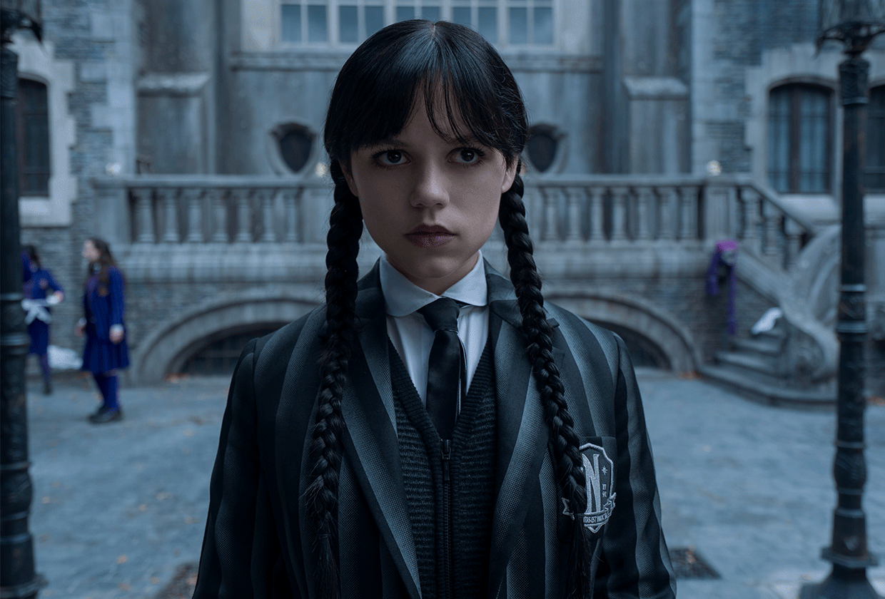 Jenna Ortega in costume as Wednesday Addams.