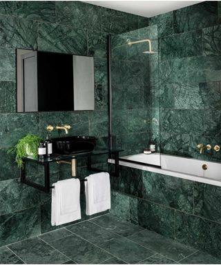 Dark green marble bathroom by Topps Tiles