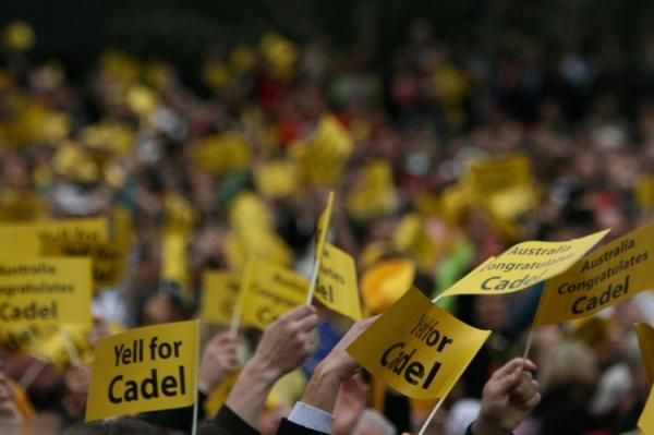 A sea of yellow 'Yell for Cadel' flags in Federation Square