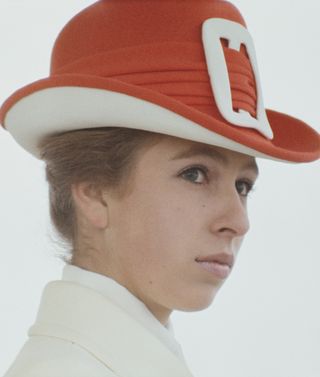 Princess Anne in a distinctive red and white hat