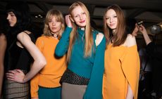 Models facing front with yellow and blue dresses