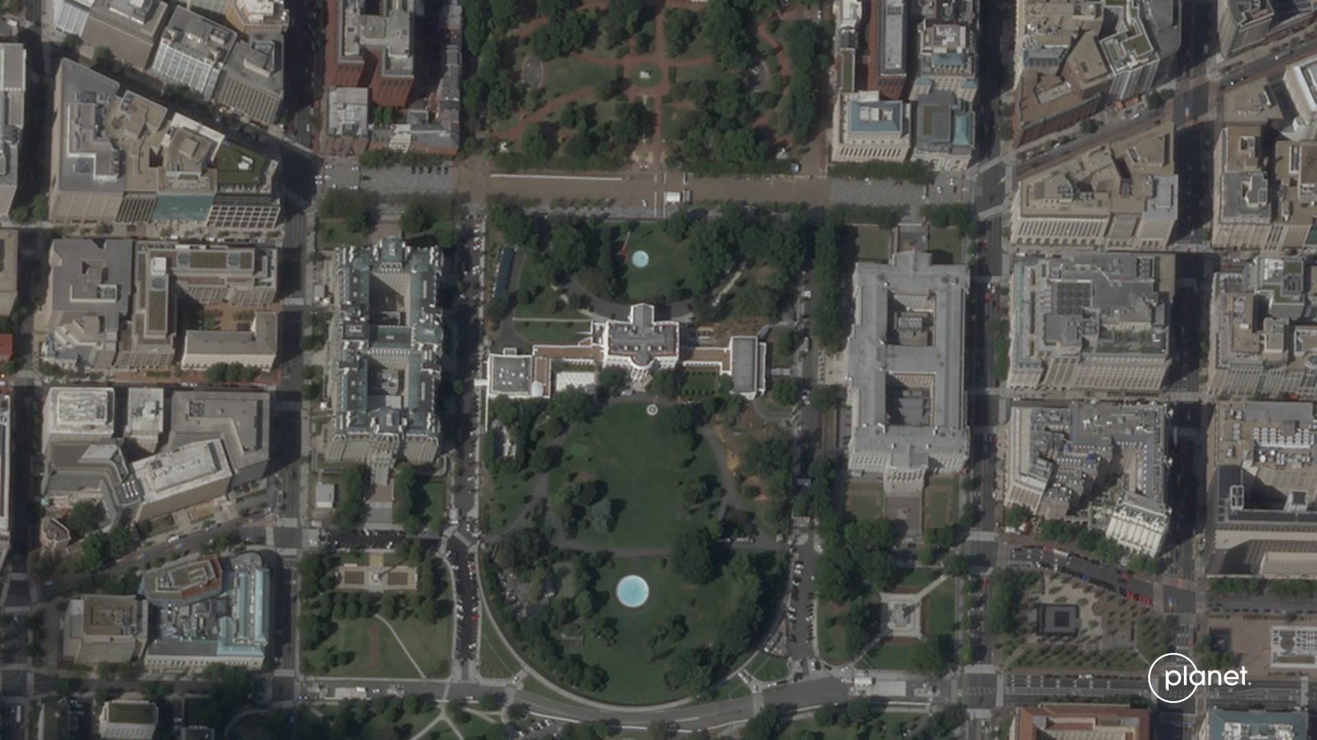 overhead images of a long rectangular building showing its eastern third being reduced to rubble