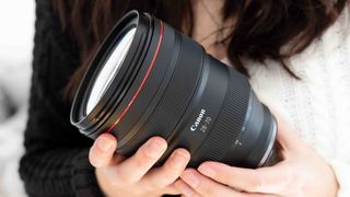 One of the best zoom lenses in 2023 in-hand with the author