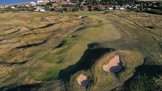 An aerial view of the par 4, fourth hole at the host venue for the 2021 Open Championship at The Royal St. George's Golf Club