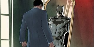 Bruce Wayne looking into mirror seeing Batman