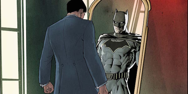 Bruce Wayne looking into mirror seeing Batman