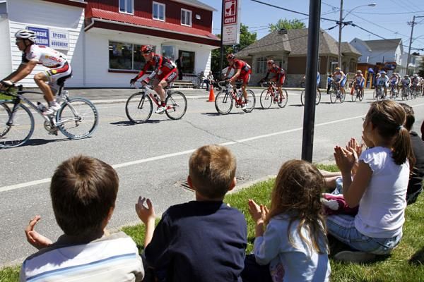 Once gain this year, several young students take time to cheer riders along the route.