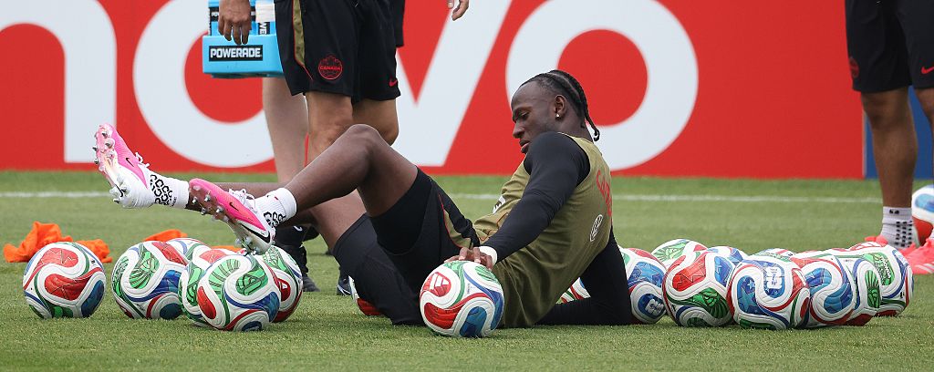 Ismael Kone sits on the floor in training