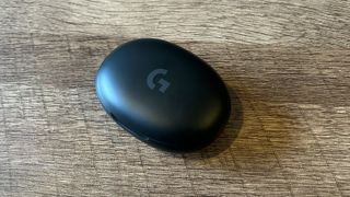 Logitech G Fits case closed and sitting on a wooden table