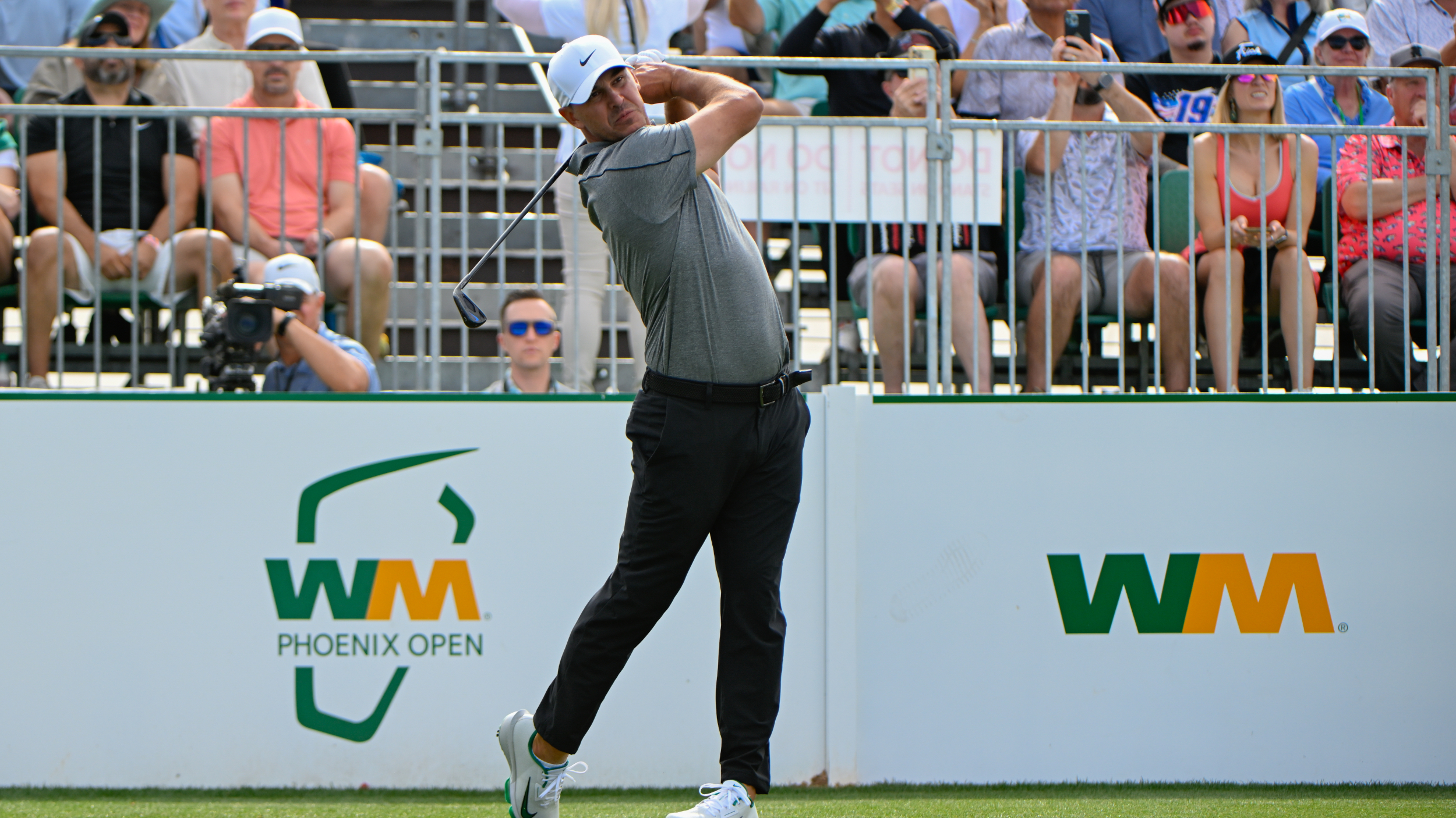 Brooks Koepka hits a tee shot at the WM Phoenix Open