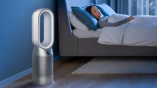 Dyson Purifier Hot + Cool HP07 next to a bed with someone sleeping