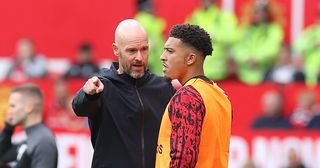 Manchester United manager Erik ten Hag talks to Jadon Sancho during the pre-season friendly match between Manchester United and RC Lens at Old Trafford on August 05, 2023 in Manchester, England. (Photo by Matthew Peters/Manchester United via Getty Images)