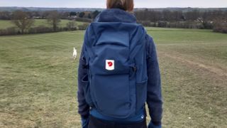 Fitness writer Lily Canter wearing the Fjällräven Ulvo backpack outside