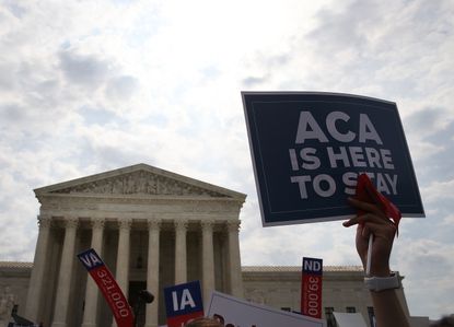 Someone hoists an ObamaCare sign in Washington