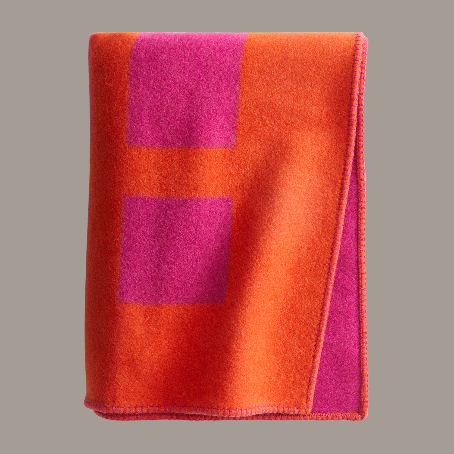 An orange and pink wool blend blanket