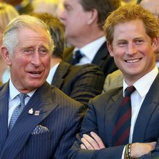 Prince Charles, Prince of Wales and Prince Harry laugh during the Invictus Games Opening Ceremony on September 10, 2014 in London, England. The International sports event for 'wounded warriors', presented by Jaguar Land Rover