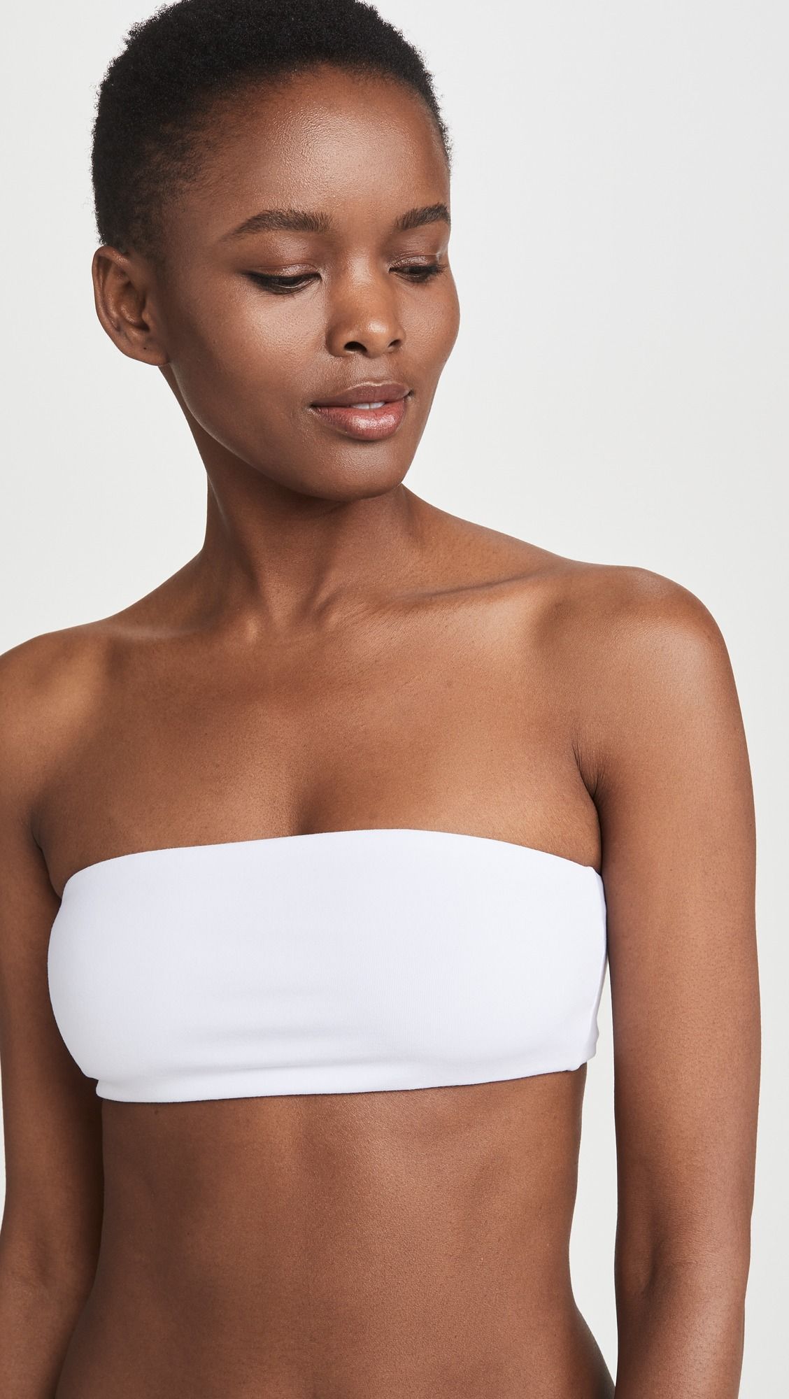 Woman wearing a white bandeau top