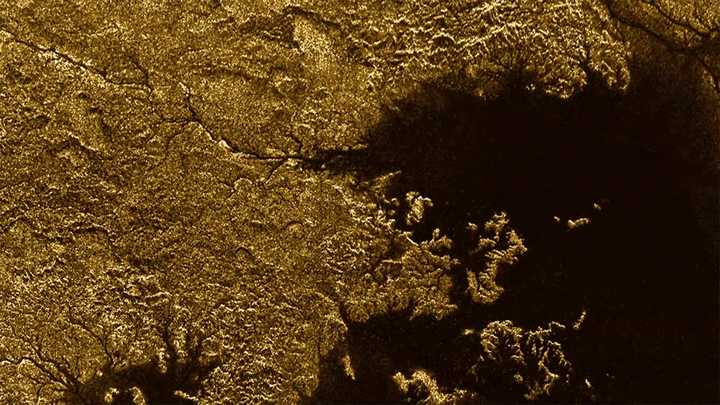 Titan&#039;s Nile-like feature Vid Flumina, a network of steep-sided canyons filled with liquid hydrocarbons, is clearly visible un the upper left of this image from NASA&#039;s Cassini spacecraft.