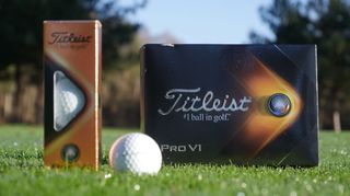 Titleist 2021 Pro V1 golf ball with packaging on the ground