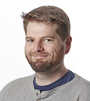 man with beard and grey shirt