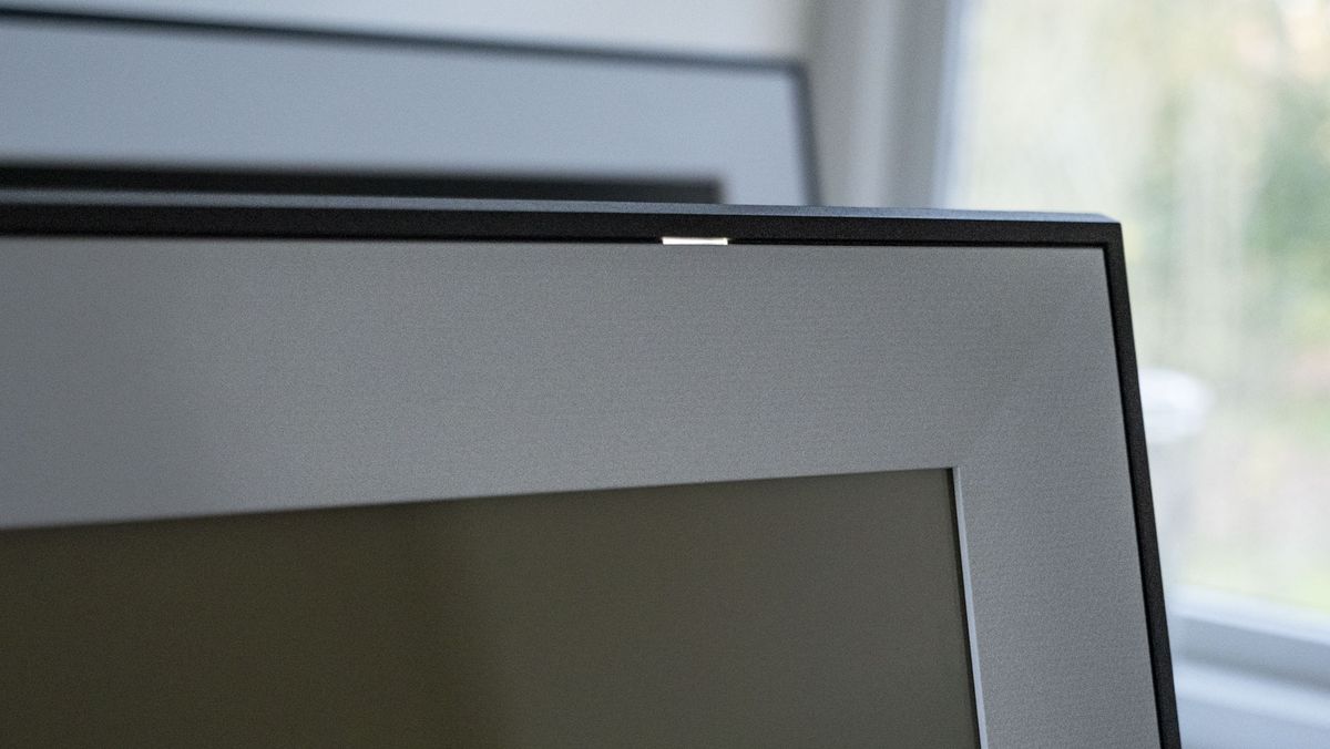 A close up of the The Aura Ink 'E Ink' digital photo frame's display power light
