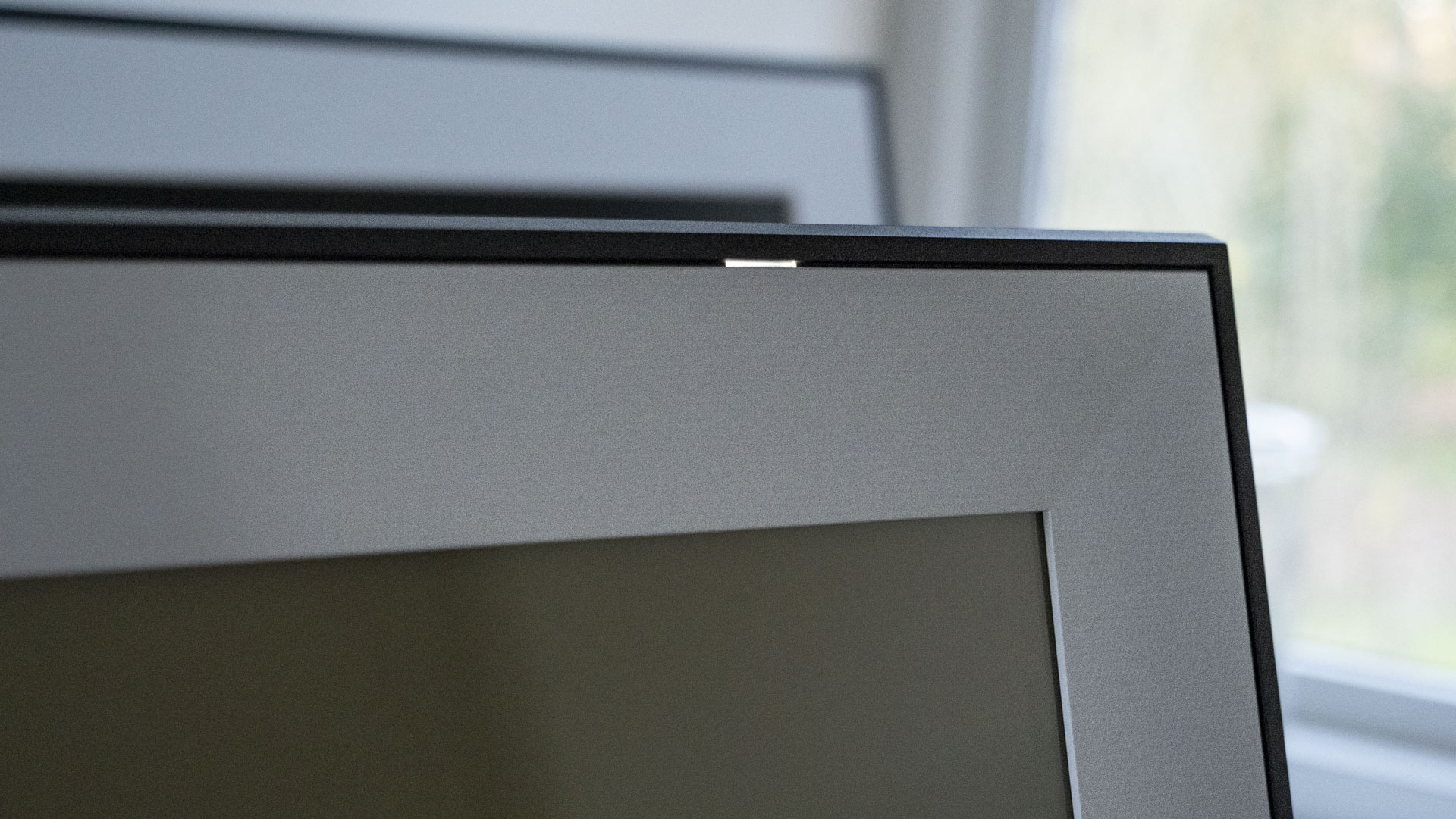 A close up of the The Aura Ink 'E Ink' digital photo frame's display power light