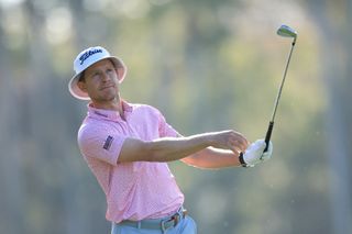 Peter Malnati watches his iron shot