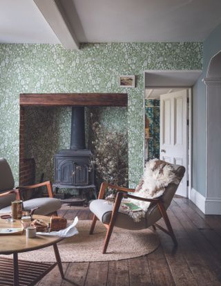 Farrow and Ball wall paper in a small, traditional living room