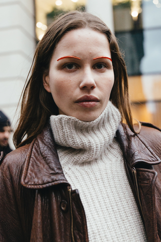 Woman at LFW 2025 with bold brows