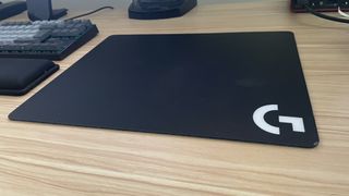 Logitech G440 mouse pad on a desk.