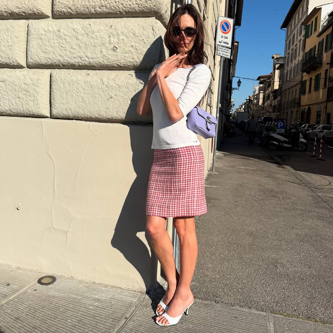 Woman wearing boatneck top.