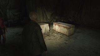 James looks at a stone casket that holds one of the Silent Hill 2 Remake rings