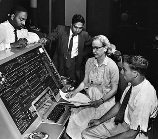 Grace Hopper sits at the UNIVAC keyboard in 1960.