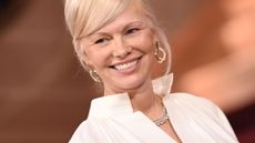 Pamela Anderson standing smiling