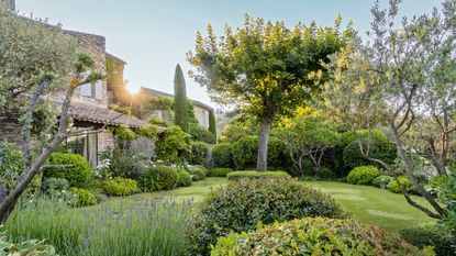 exterior of stone house with garden