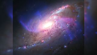 a colorful swirl of light on a black background
