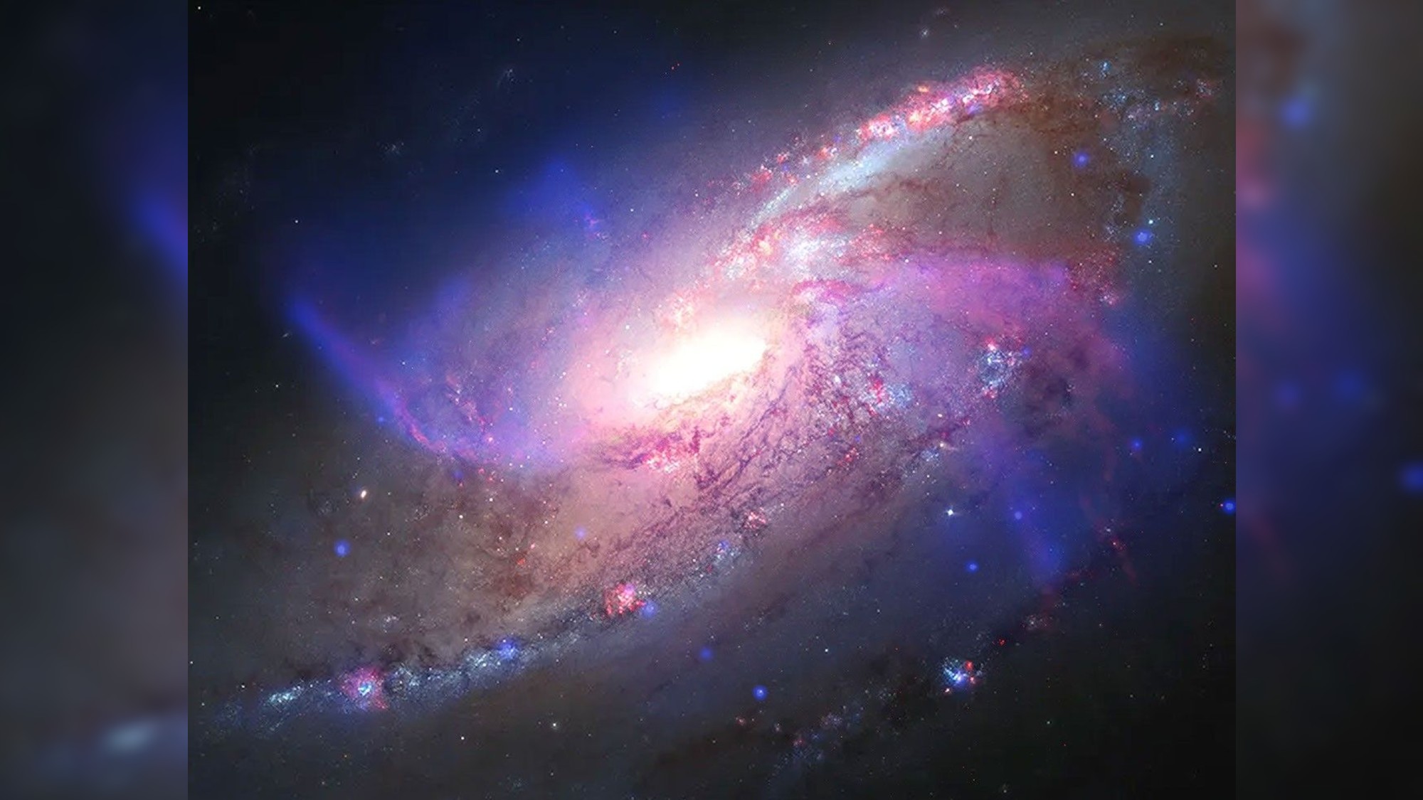 a colorful swirl of light on a black background