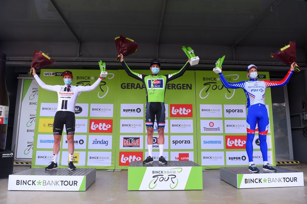 GERAARDSBERGEN BELGIUM OCTOBER 03 Podium Soren Kragh Andersen of Denmark and Team Sunweb Mathieu Van Der Poel of The Netherlands and Team AlpecinFenix Green Leader Jersey Stefan Kung of Switzerland and Team Groupama FDJ Celebration Trophy Mask Covid safety measures Flowers during the 16th BinckBank Tour 2020 Stage 5 a 1836km stage from Ottignies Louvain la Neuve to Muur van Geraardsbergen 108m BinckBankTour BinckBankTour on October 03 2020 in Geraardsbergen Belgium Photo by Luc ClaessenGetty Images